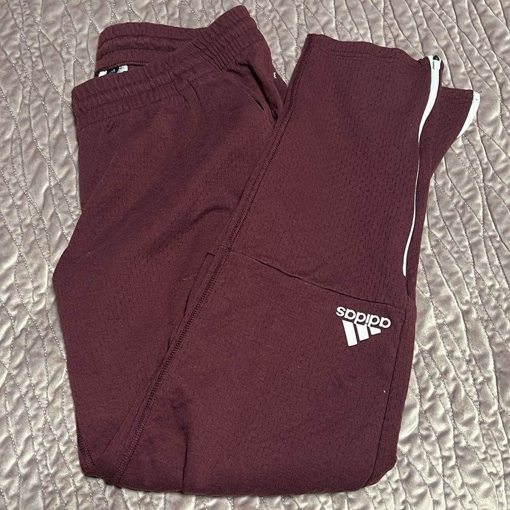 L Adidas sweat pants. Zippers on the bottom